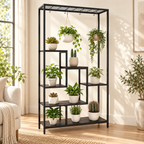 Aster six-tier black indoor plant stand styled with potted and hanging plants in a warm living room
