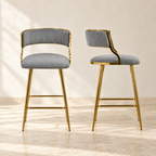 Two Linden gray corduroy counter stools with gold-tone legs and footrests