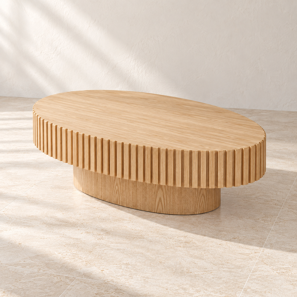 Angled view of Forma’s oval tabletop and inset pedestal base