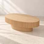Angled view of Forma’s oval tabletop and inset pedestal base