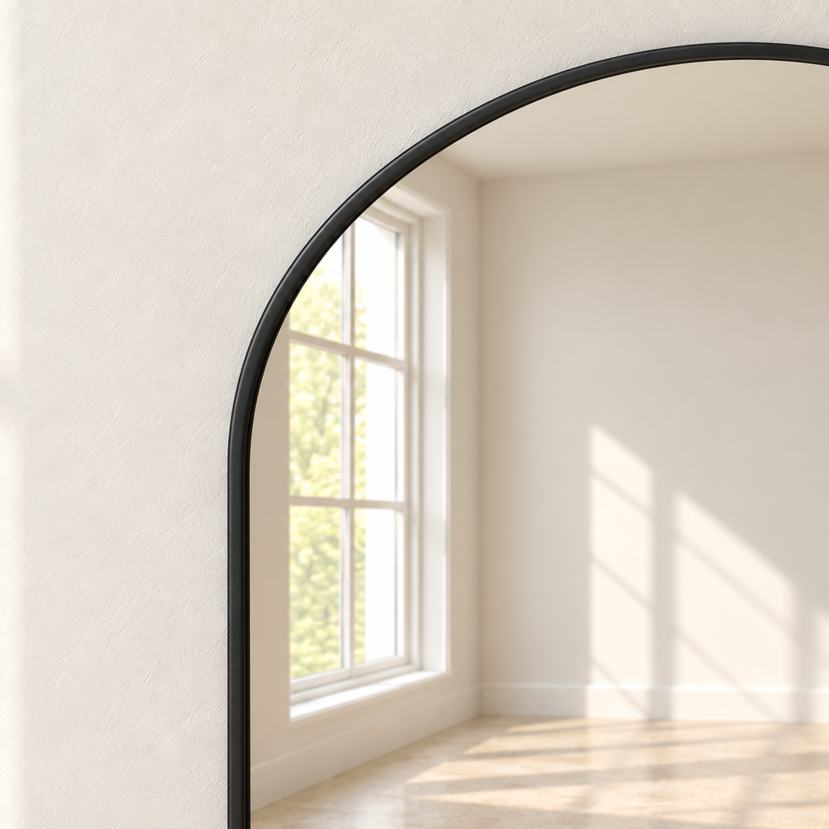 Close-up of Arc’s slim black frame around the arched mirror