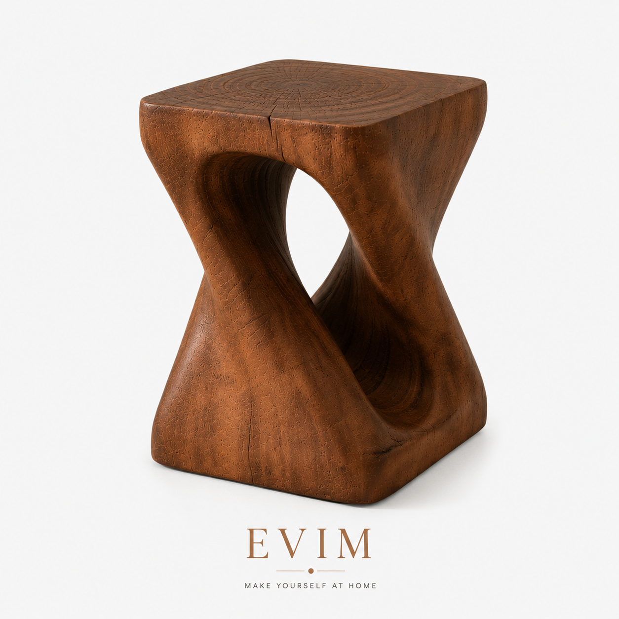 The Sculpt Accent Table in a walnut finish with a twisted hourglass silhouette and open center.