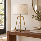 Arden lamp placed on a console beside books