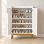 Open Aurelia white and gold shoe cabinet displaying five tiers filled with assorted shoes.