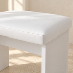 Close-up of Clara white cushioned stool and stitched seat edge