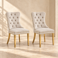 Elara beige velvet and gold dining chairs, set of two, in a warm neutral interior