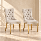 Elara beige velvet and gold dining chairs, set of two, in a warm neutral interior