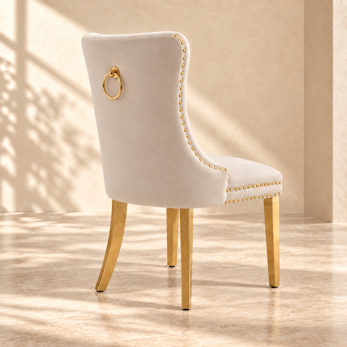 Elara beige dining chair rear view with gold ring and smooth upholstered back