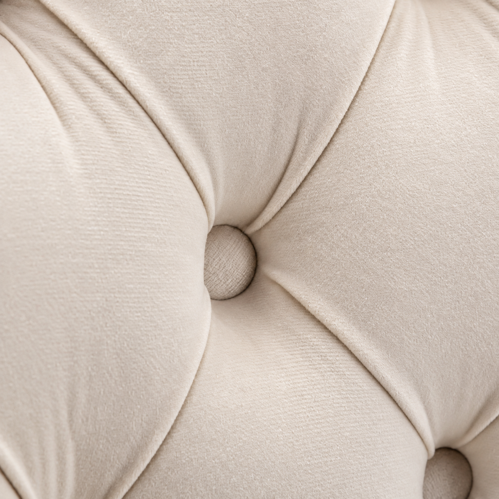 Close-up of Elara beige velvet button tufting