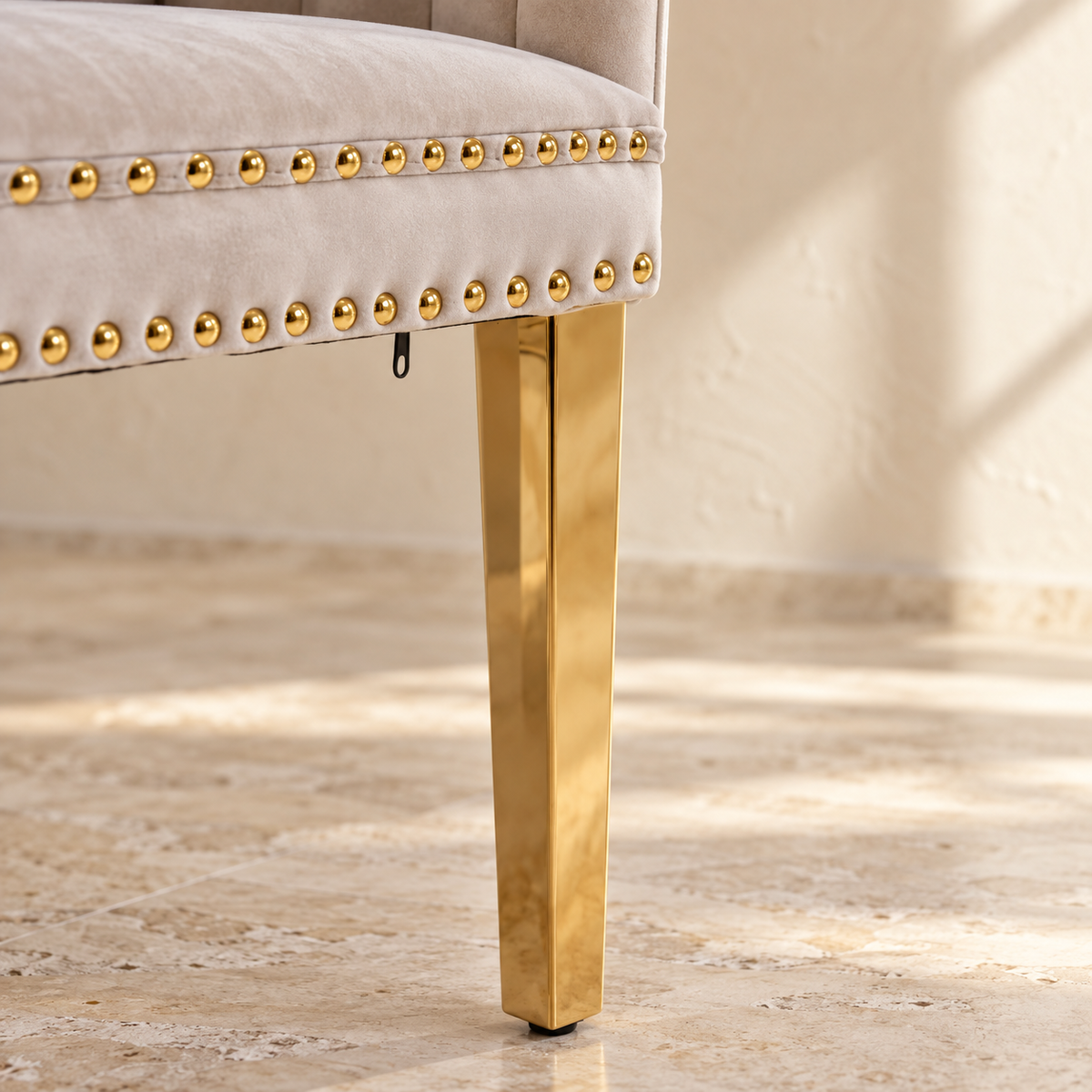 Elara double gold nailhead trim and polished gold leg detail
