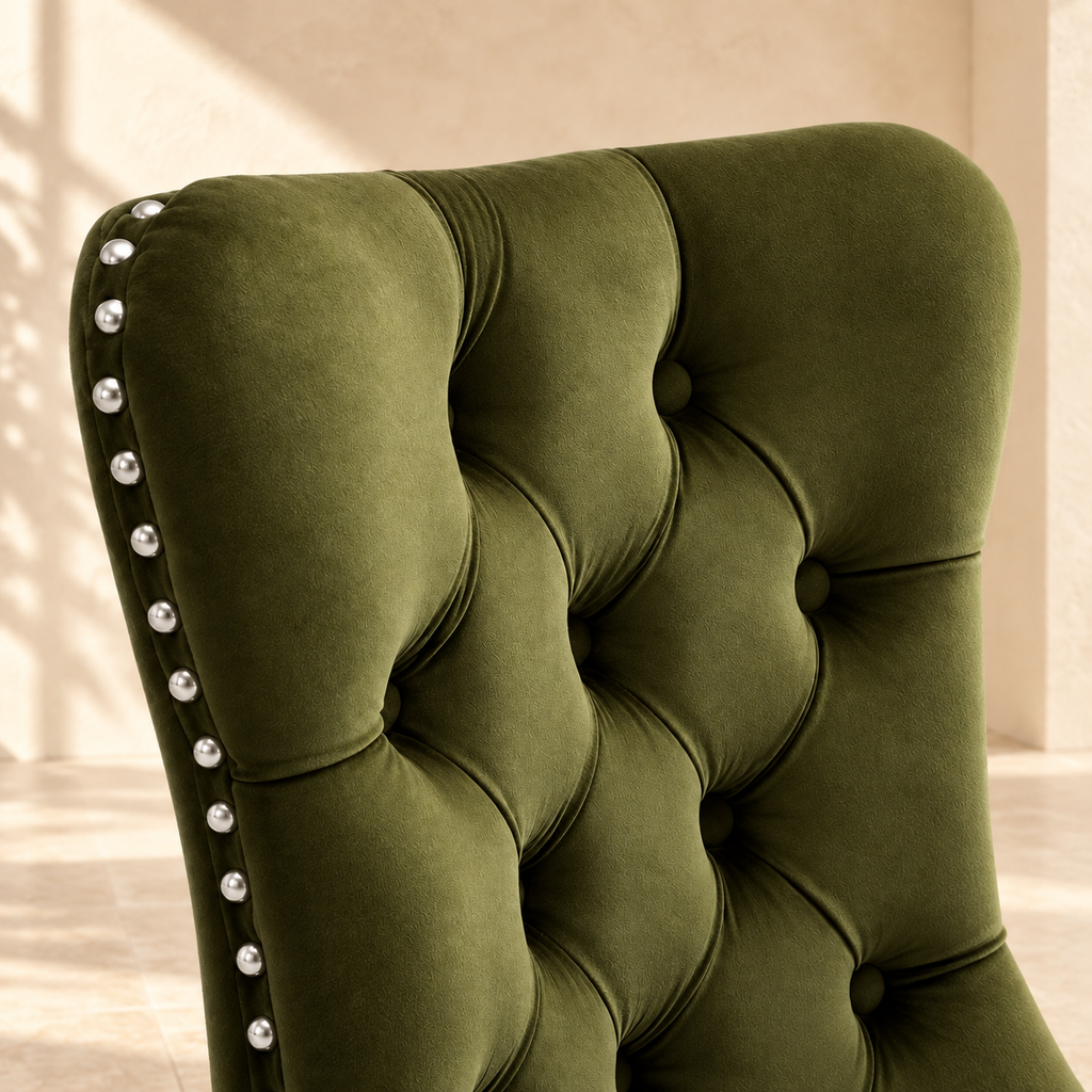 Close-up of Elara olive velvet button tufting and silver nailhead trim