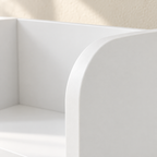 Close-up of the Mira bookcase’s rounded white divider edge
