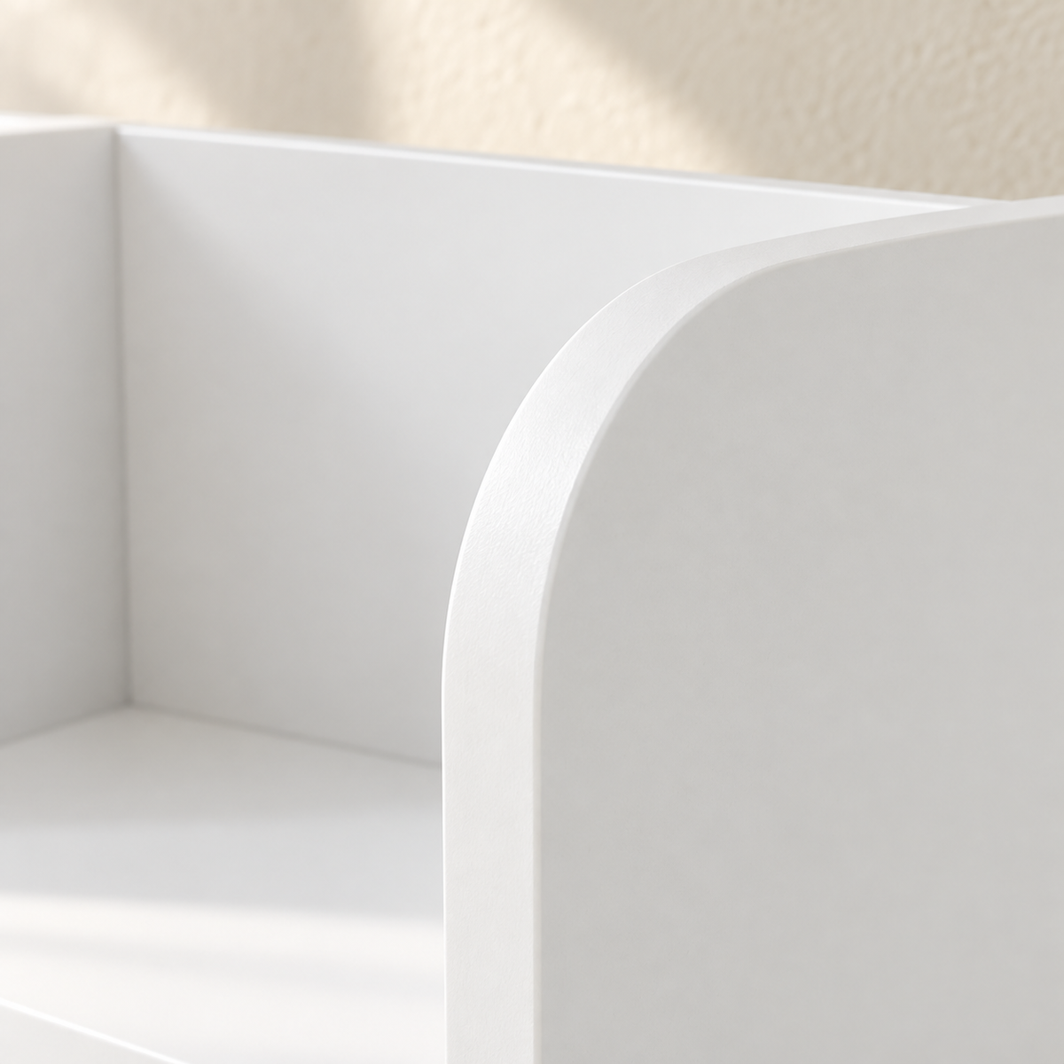 Close-up of the Mira bookcase’s rounded white divider edge
