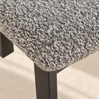 Close-up of the Nola chair’s textured black-and-white upholstery