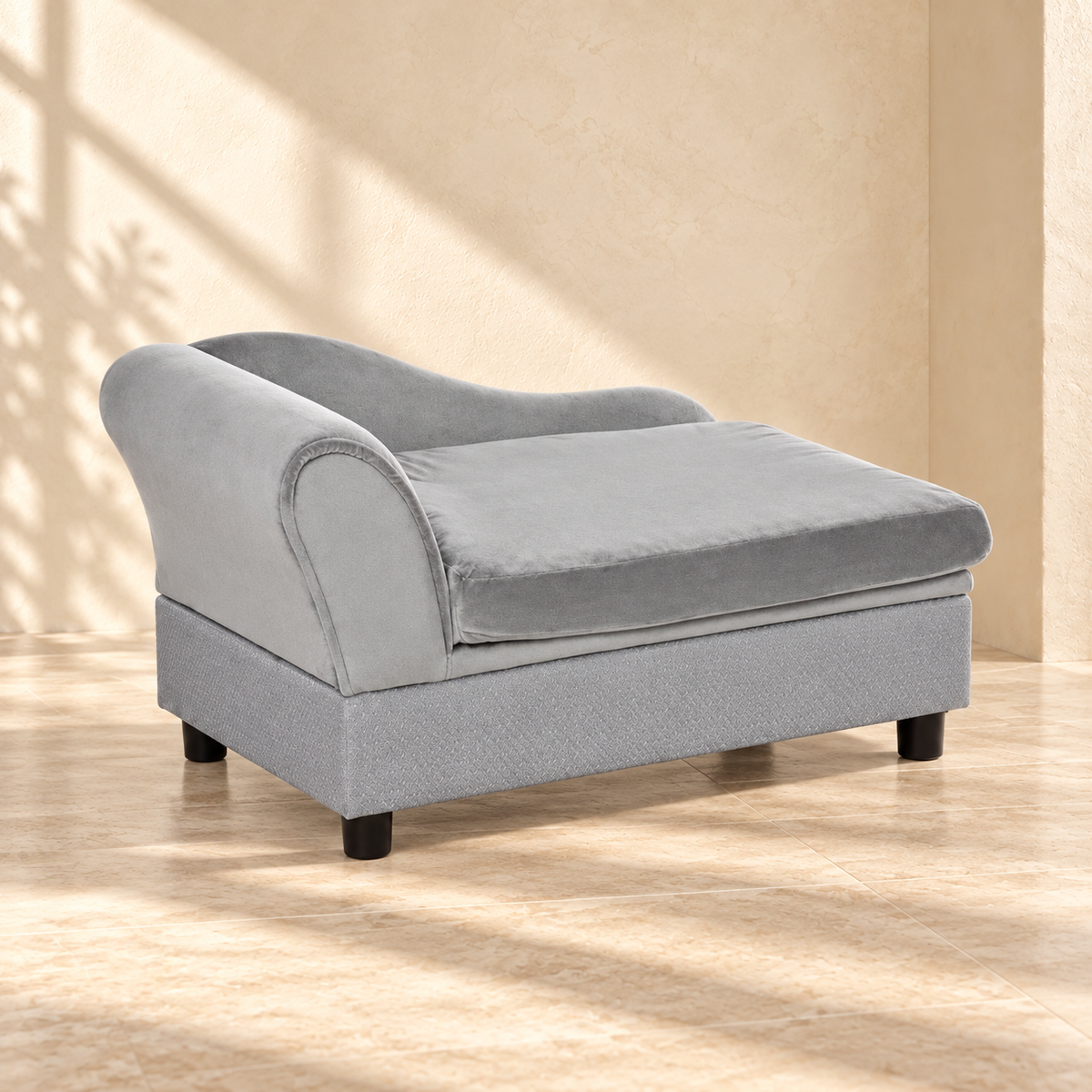 Pip gray pet sofa angled view showing the rolled arm and raised base