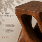 Close-up of The Sculpt Accent Table highlighting its solid suar wood grain, sculptural shape, and natural character.
